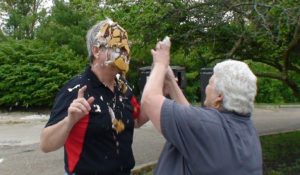 LSPT President face covered in whipped cream pie moments after impact 